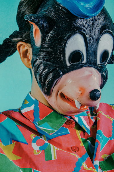 Person in colorful mickey mask